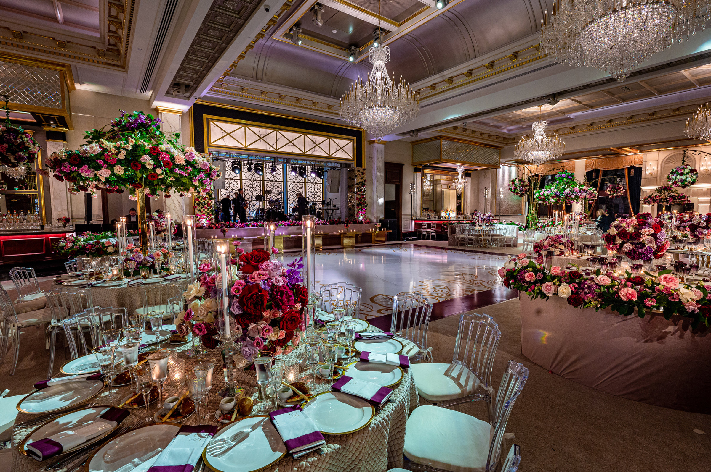Ballroom tables dressed with tall pink and white florals
