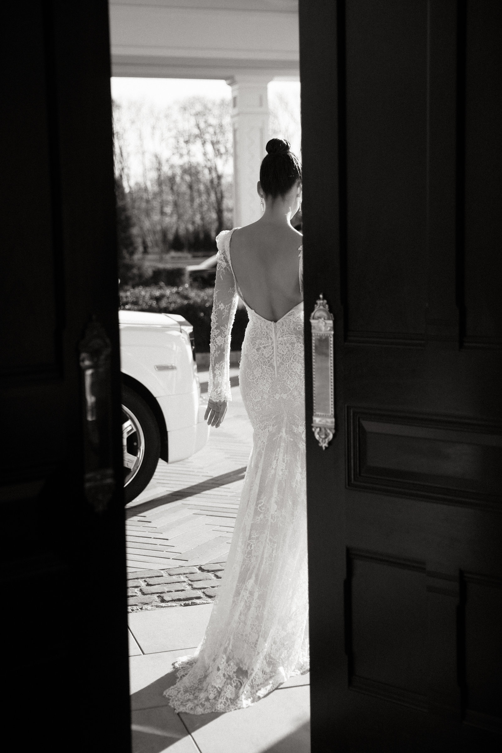 A bride framed by the open front doors