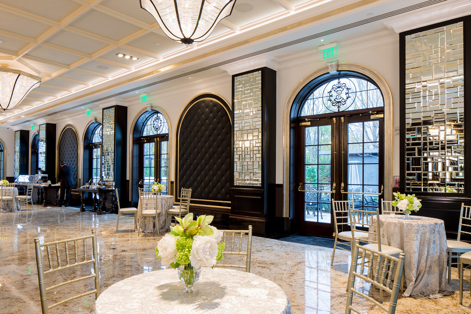 A bright cocktail lounge with arched French doors
