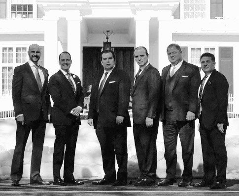 The partners of Shadowbrook in front of the mansion