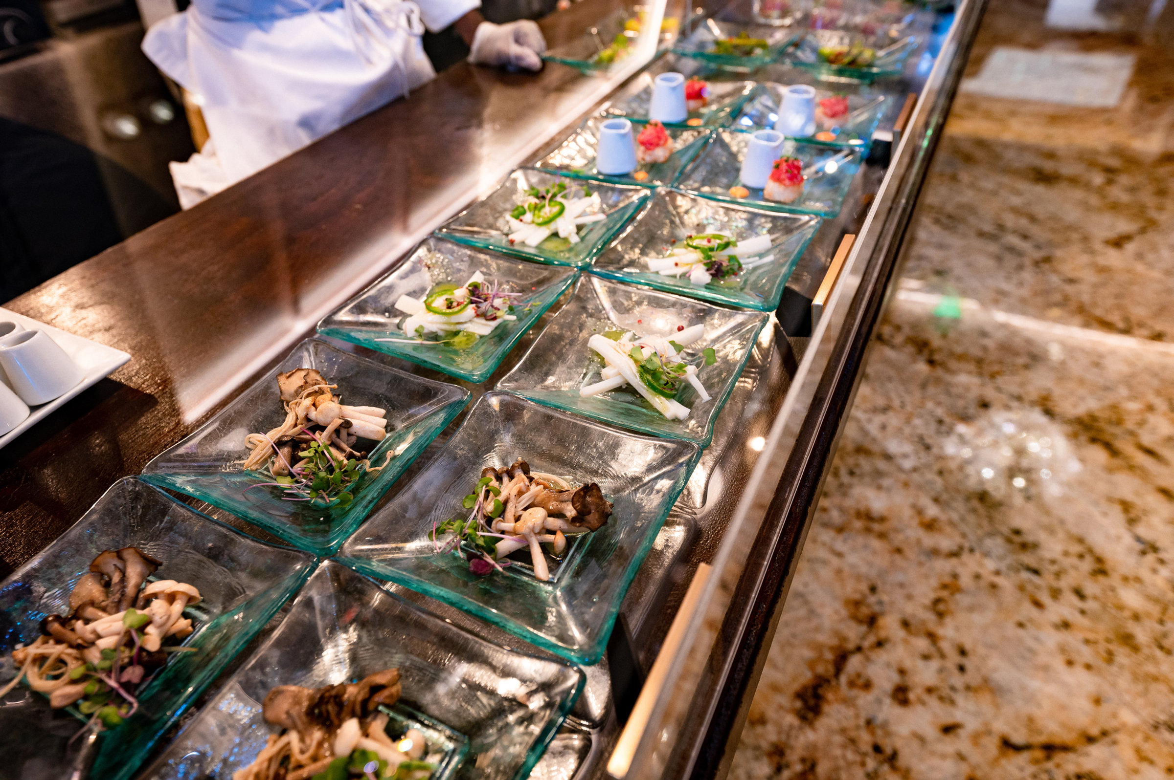 A chef’s raw bar of individually plated seafood